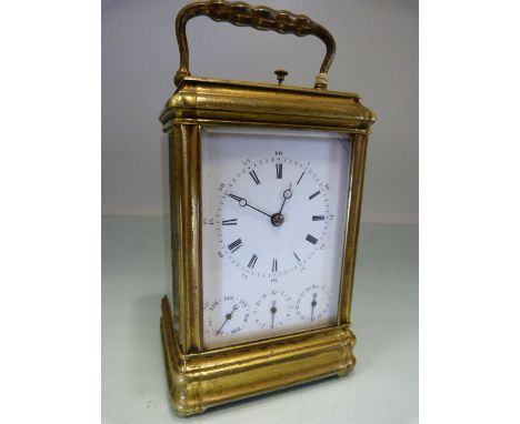 French Aiguilles brass carriage clock with three additional dials below for day/ month/ date, the dial with Roman and Arabic 