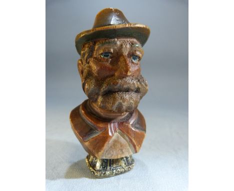 Carved wooden bust of a man with hat, underside a later addition is a gold coloured metal Georgian seal set with an agate sto