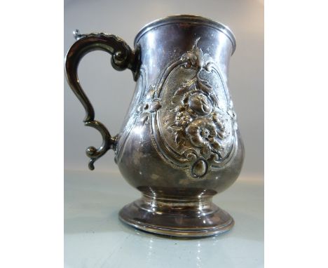 Victorian Silver tankard of Baluster form with embossed flowers and foliate scrolls flanking a shield, engraved 'Won by Blue 