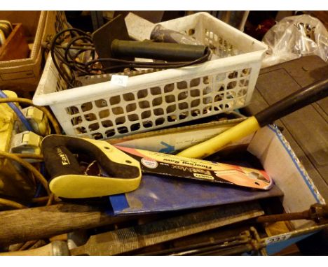 Collection of mixed hand tools including axes and saws