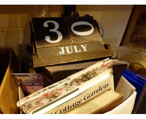 Box of mixed items including decanters, cook books and an oil lamp