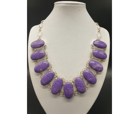 A rare and beautiful, white metal (untested) RUSSIAN CHAROITE necklace and earrings set in a presentation box. Necklace lengt