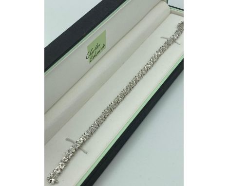 SILVER  and DIAMOND TENNIS BRACELET each  Silver piece having a centre diamond. Full UK hallmark. Presented in a quality jewe