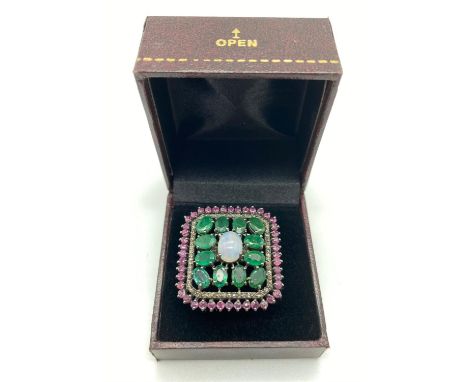 An Emerald, Ruby, Diamond and Opal Silver Ring. 5ct Emerald. 0.82ct Opel. 0.70ct Diamond. Size 0. 11g 