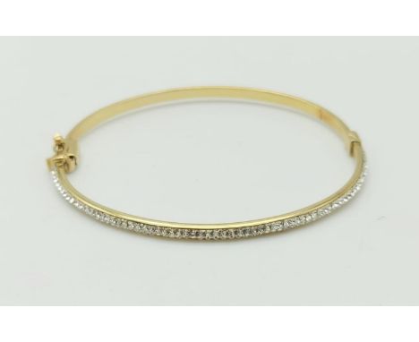 A 9K Yellow Gold Half Eternity Diamond Bangle.6cm diameter. 3.7g 