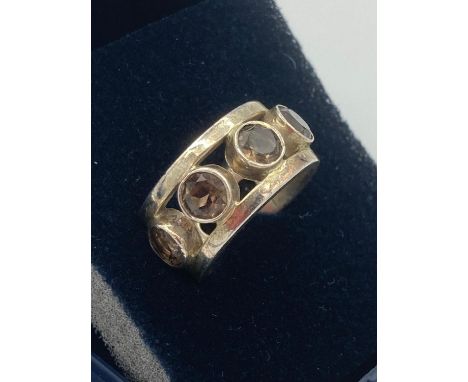 VINTAGE SILVER RING set with smokey Quartz  stones forming a complete circle around the ring.Size J- K. 