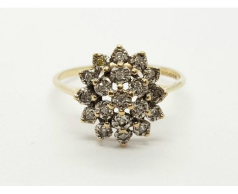 9k yellow gold cluster ring with 19 petite diamonds. Ring size R, weight 2.08 grams 