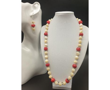 A vintage and very pretty mother of pearl box, revealing&nbsp; (when opened) an even prettier necklace and earrings set with 