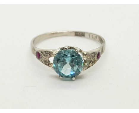 An 18K White Gold CZ and Ruby Ring. Size R. 2.66g 