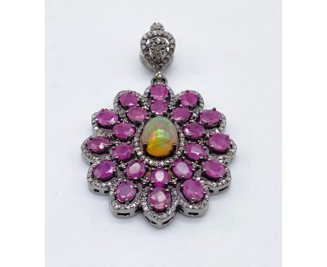 A Ruby, Opal and Diamond Pendant. 7.5ct Ruby. 2ct Opal. 1.4ct diamond. 14g 