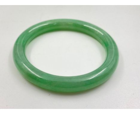 Green jade bangle, 7cm diameter, child size hands only. 