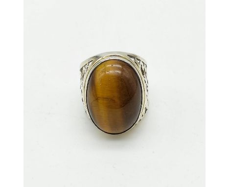 A Vintage Silver Tigers Eye Ring. Large oval centre stone. Size U. 14g. Possibly Iranian. 