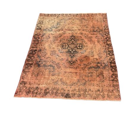 Persian rug, shaped central medallion surrounded by trailing branch and flower heads, floral design border with signature pan