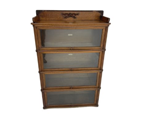 Mid-20th century oak 'Globe Wernicke' library stacking bookcase, four sections each with hinged and sliding glazed doors, sha