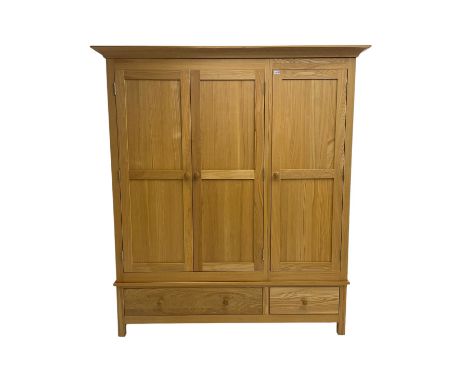 Light ash triple wardrobe, enclosed by three panelled doors, the base fitted with two drawersDimensions: Height:&nbsp;197cm&n