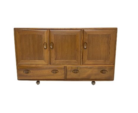 Ercol - light elm sideboard, fitted with three cupboards and two drawers, on castorsDimensions: Height:&nbsp;76cm&nbsp; Lengt