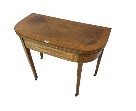 Early 19th century mahogany demi-lune card table, swivel fold-over top with satinwood band and baize lined interior, on squar