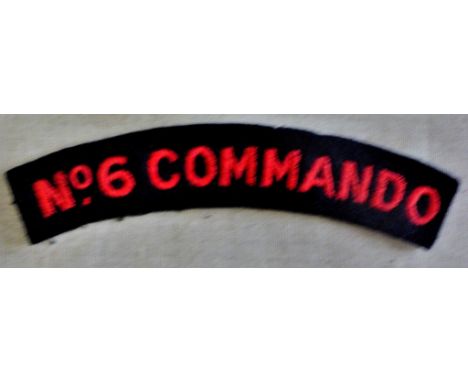British WWII No.6 Commando Sleeve title cloth patch, red on black. 