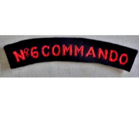 British WWII No.6 Commando Sleeve title cloth patch, red on black. Larger variant 