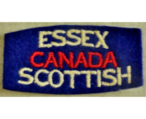 Canadian Essex Scottish Regiment of Canada cloth shoulder title patch, white and red on blue backing