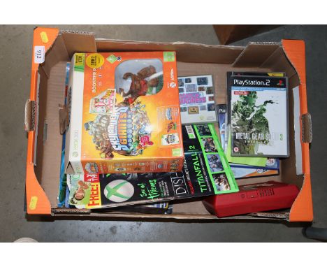 A box of computer console games and Nintendo Wii console