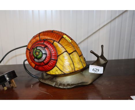 A novelty table lamp in the form of a snail