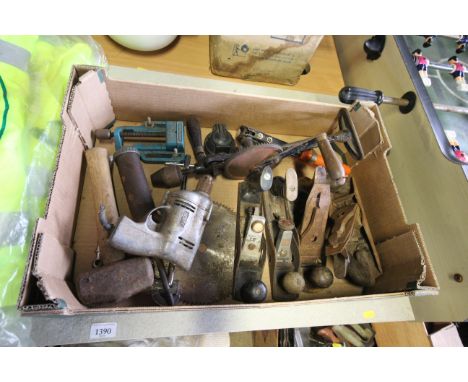A tray box containing various tools to include smoothing planes, hand braces, circular saw blade etc.
