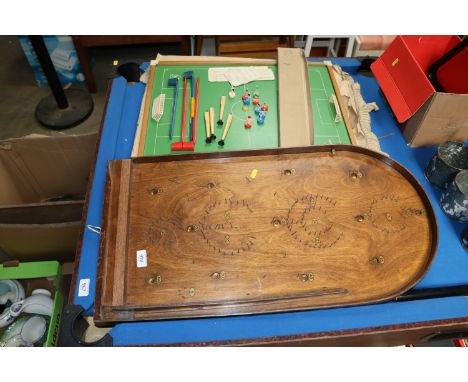 A bagatelle board and a Super Soccer game