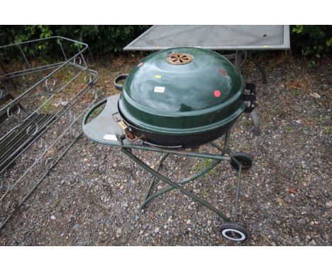A B &amp; Q outdoor charcoal BBQ with enamel hinged lid on wheeled folding base