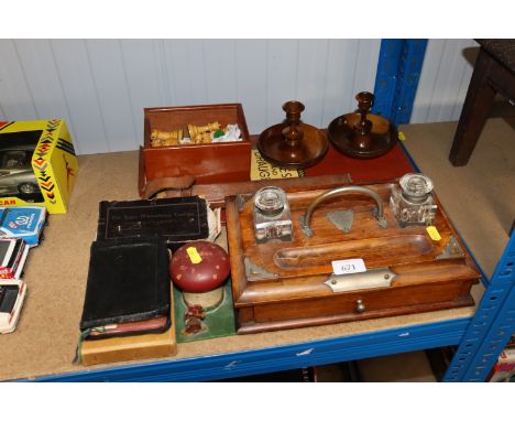 A pair of olive wood candlesticks, a box of wooden chess pieces, desk stand fitted with ink wells etc