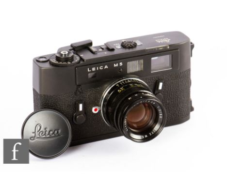 A Leica M5 camera with summicron f2/50 lens, black body, serial number 1290483. 