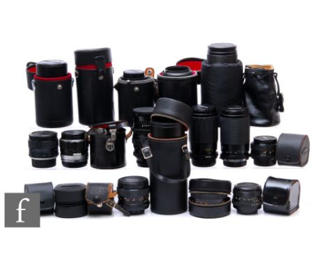 A large quantity of various lenses, including Miranda, Pentacon, Minolta, Soligor, Cosina, Tamron and Vivitar. (23) 