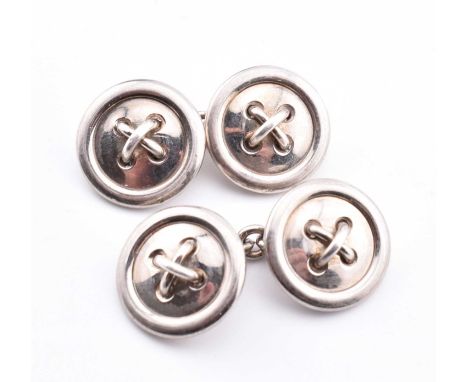 A pair of hallmarked silver Longmire button cufflinks. The sterling silver cufflinks of button form unified by chain links. H