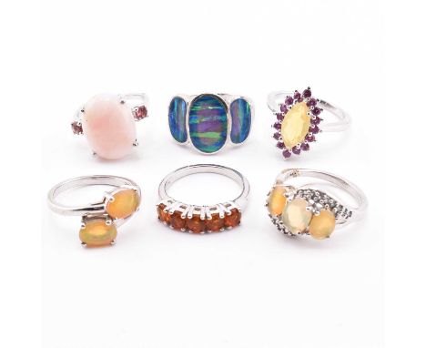 Six silver and opal gem set rings. The rings to include a pink opal and pink tourmaline sterling silver ring 3.7g, size L, wi