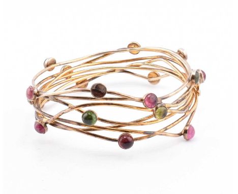A tourmaline bangle bracelet by Lila Designs - Lila Stern-Shewry. The lot to include a gold plated bangle bracelet set with m