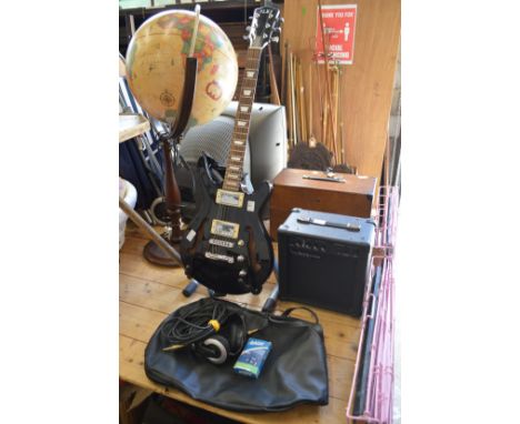 An Alba electric guitar complete with a Watson amplifier, headphones and accessories.