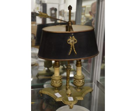 A brass desk lamp.