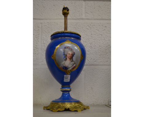 A decorative French porcelain and ormolu lamp base.