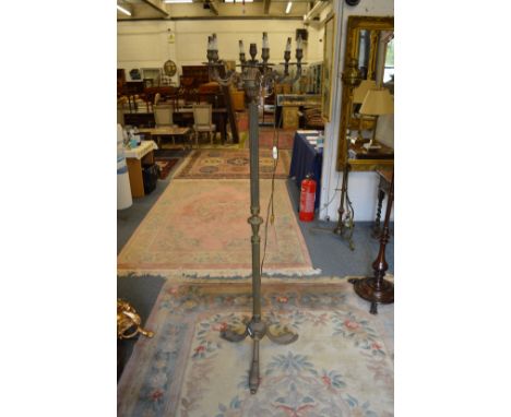 An ornate floor standing lamp.