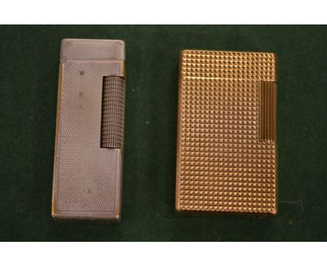 A Dupont lighter and a Dunhill lighter.