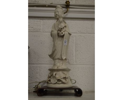 A blanc-de-chine Guanyin figure mounted as a lamp.