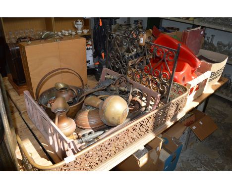 A wrought iron fireguard, brass fender and other metalware.