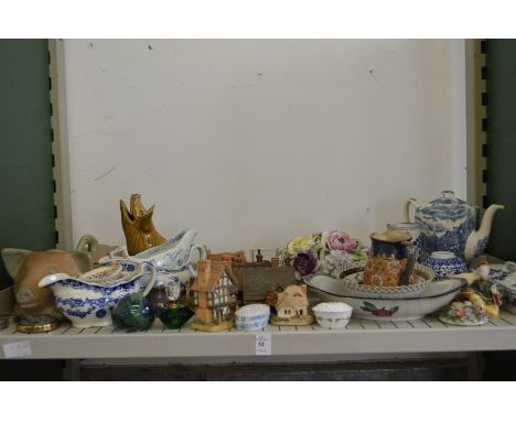 A shelf of decorative china etc.