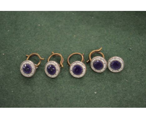 Five silver and enamel studs.