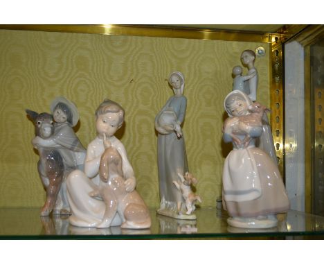 Lladro and Nao figure groups.