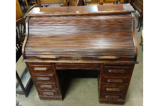 A Victorian Mahogany Tambour Front Roll Top Pedestal Desk Made By