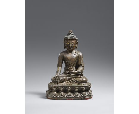 Medizin-Buddha Bhaishajyaguru. Bronze. Ming-Zeit, 15. Jh.Im Meditationssitz auf einem doppelten Lotosthron, die rechte Hand h