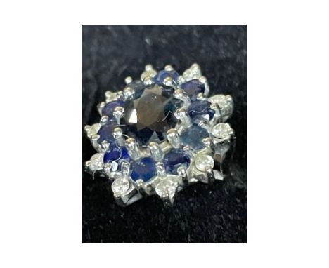 JEWELLERY - 1960s 18 CARAT WHITE GOLD SAPPHIRE &amp; DIAMOND CLUSTER RING
A stunning mid 20th century cluster ring in very br