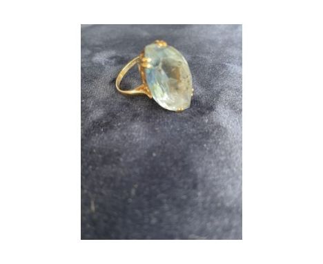 JEWELLERY - 9 CARAT GOLD &amp; BLUE TPOAZ DRESS RING
A large and impressive dress ring. Hallmarked 9 carat gold band set with