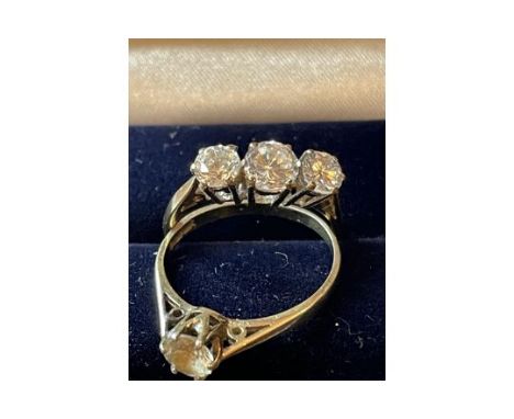 JEWELLERY - 2 DRESS RINGS 1 - 9 CARAT 1- SILVER GILT
2 pretty dress rings set with white stones. The 3 stone ring is set in 9